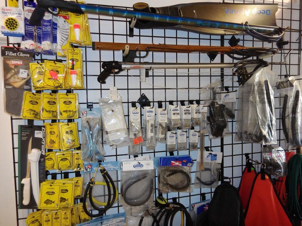 wall of spearfishing gear