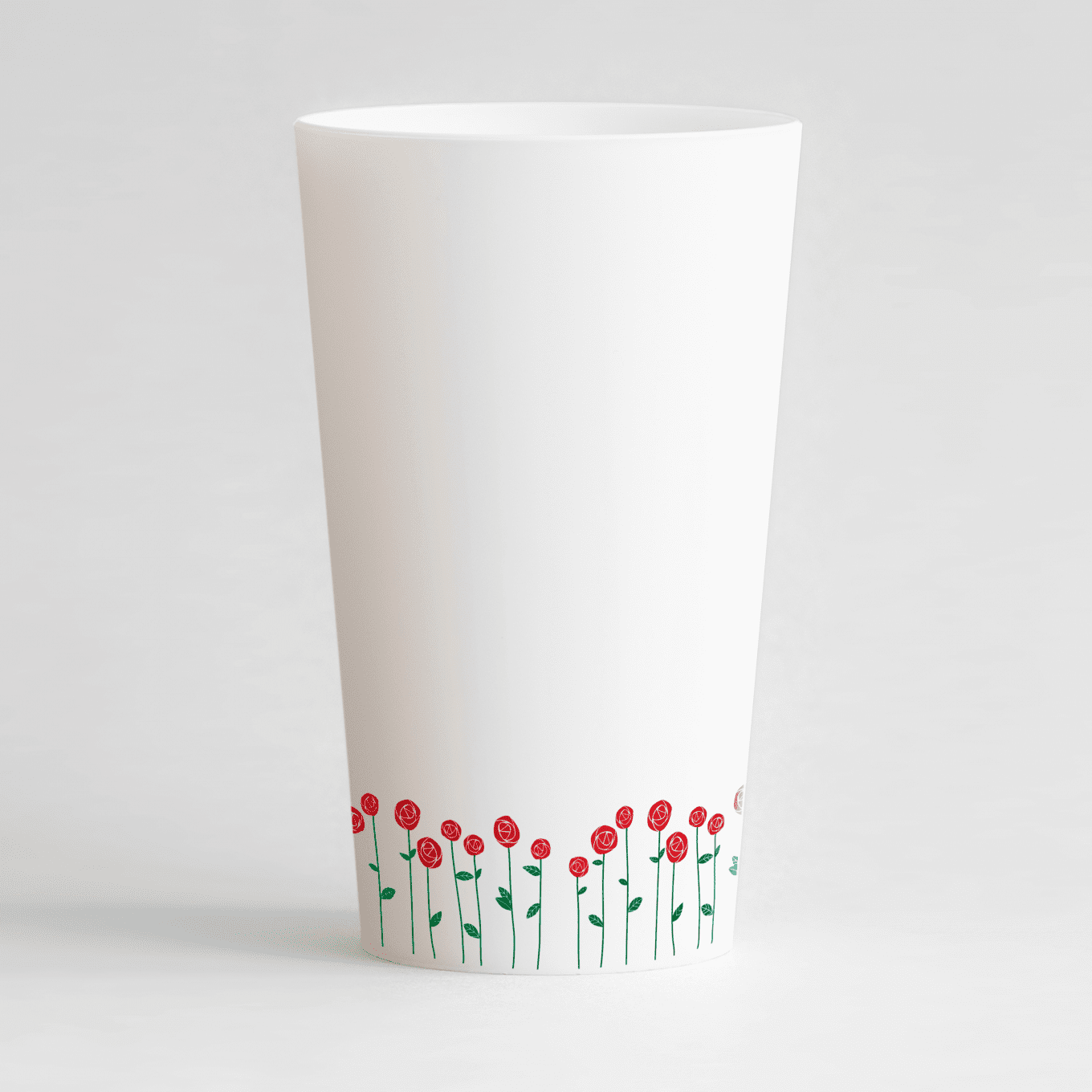 Un ecocup blanc de dos avec une frise de roses.