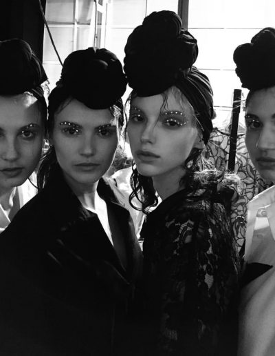 Fashion Week Sydney Australia four models pose with top knot hair accessories and some hair on the face