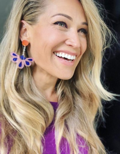 Erika Heynatz blonde highlights and balayage hair colour with a long hair layered haircut and wavy hairstyle done by Headcase Hair Potts Point Sydney