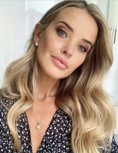 Kahili Blundell golden blonde hair colour with blonde balayage and face frame highlights on long hair and wavy hairstyle