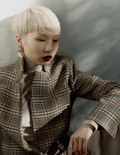 Vogue Australia a girl with a short haircut and bowl straight hairstyle with bleach blonde hair colour on Asian hair