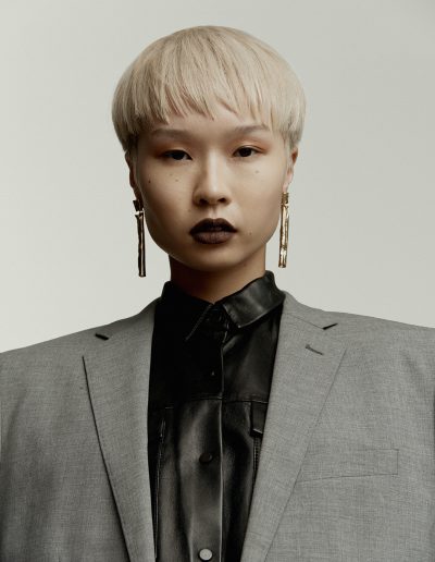Vogue Australia a girl with a short haircut and bowl straight hairstyle with bleach blonde hair colour on Asian hair