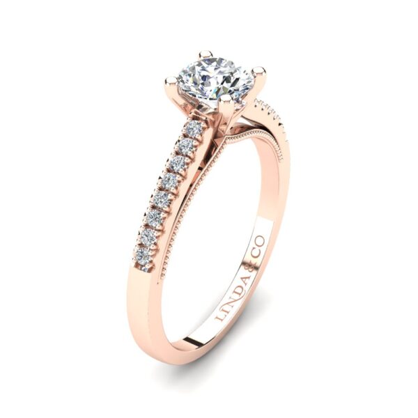 Solitaire engagement ring with side stone