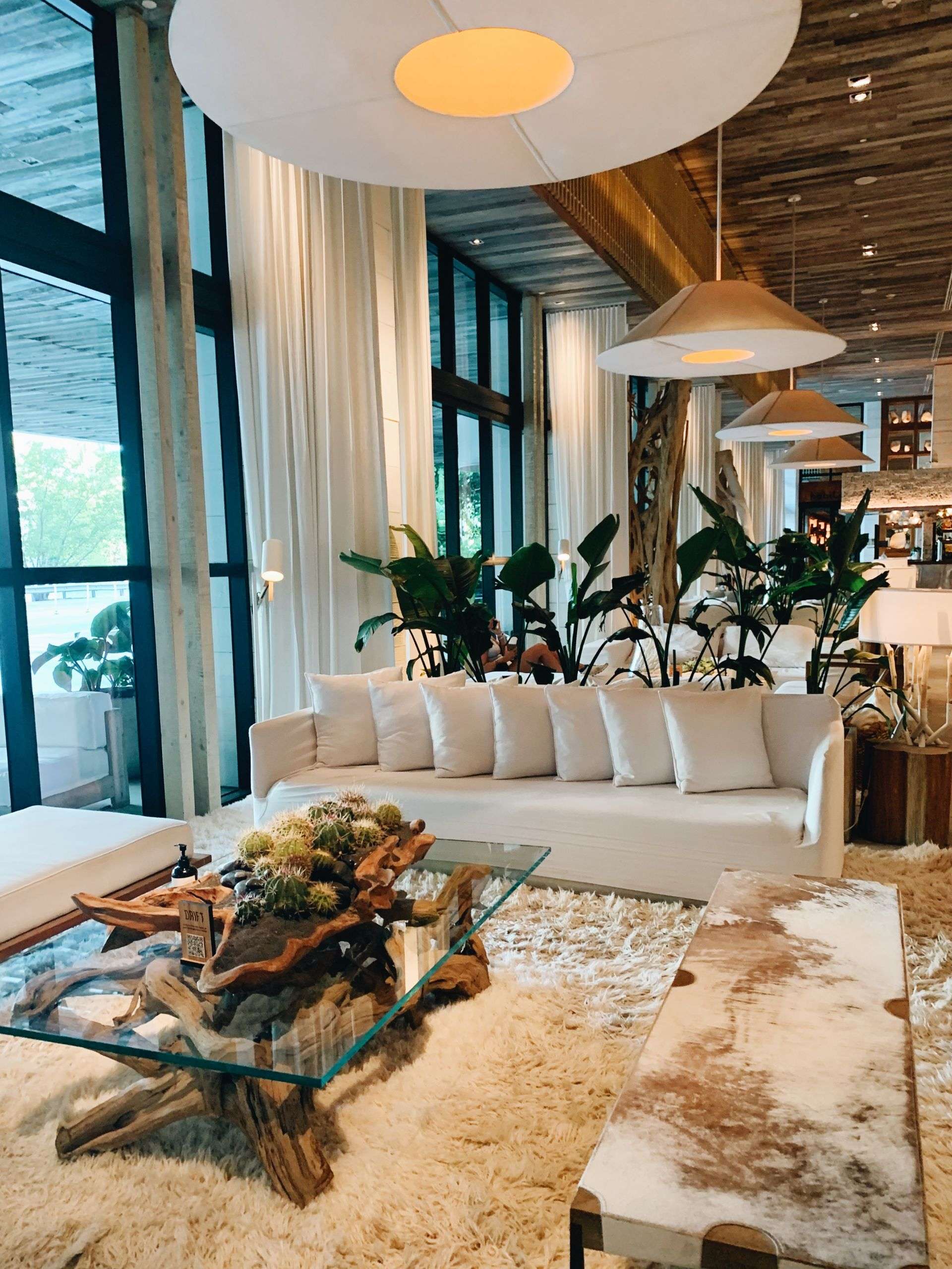 Stylish interior decor of 1 Hotel Miami Beach lobby, blending modern design with natural elements.