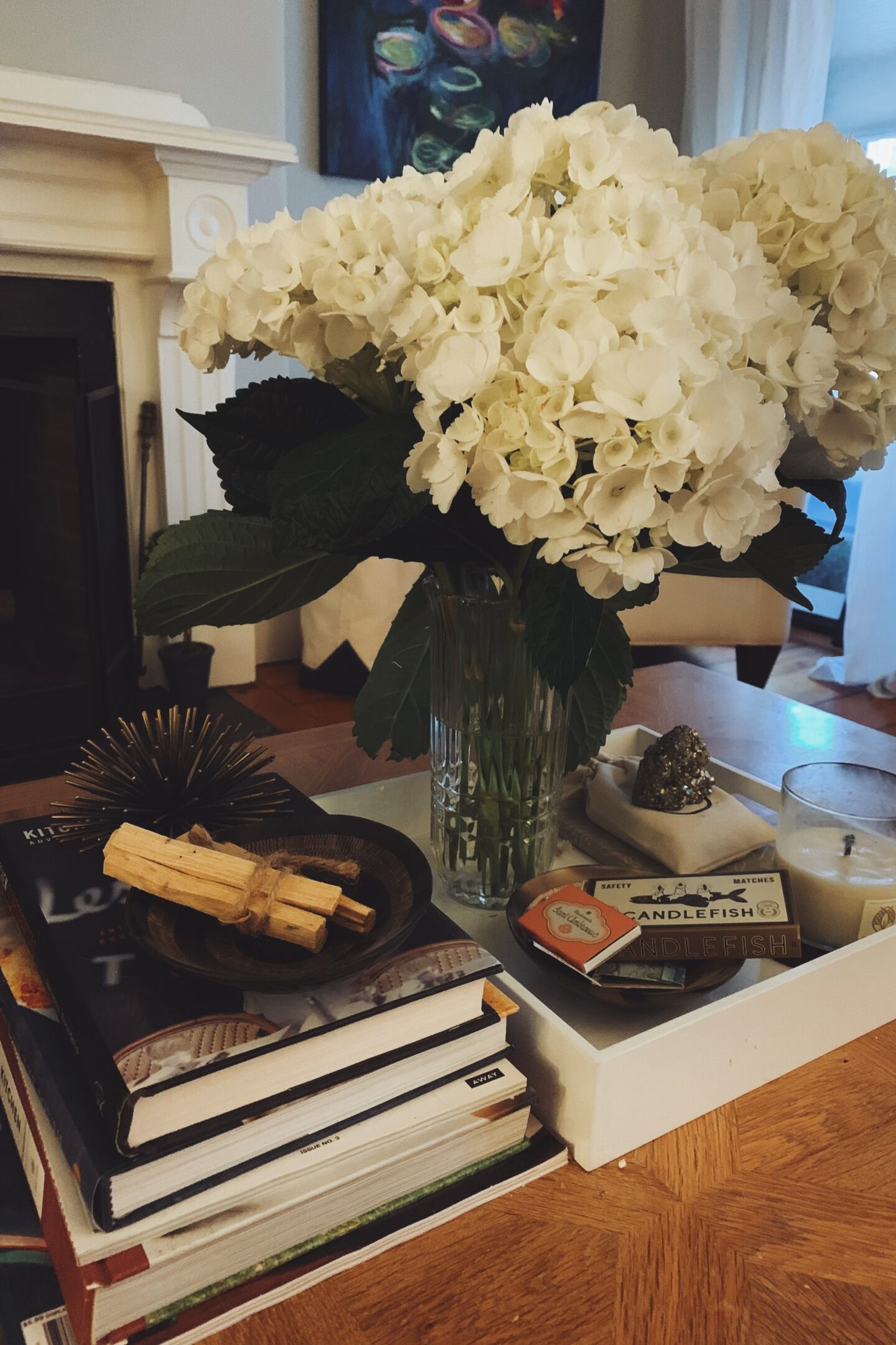 Books on a coffee table with flowers