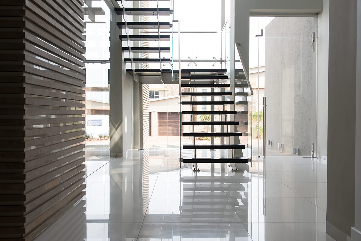 Stainless steel staircase with timber treads and glass balustrades 