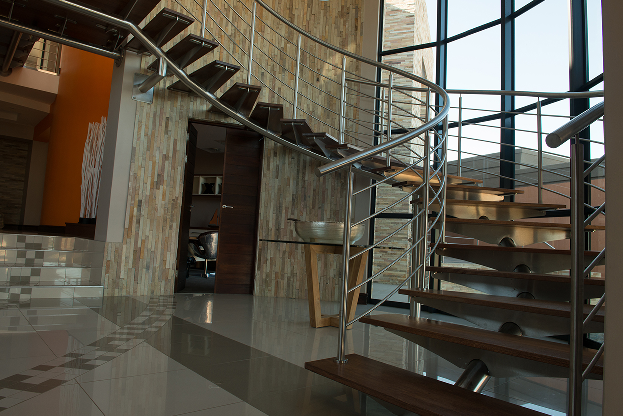 Stainless steel spiral staircase with timber treads