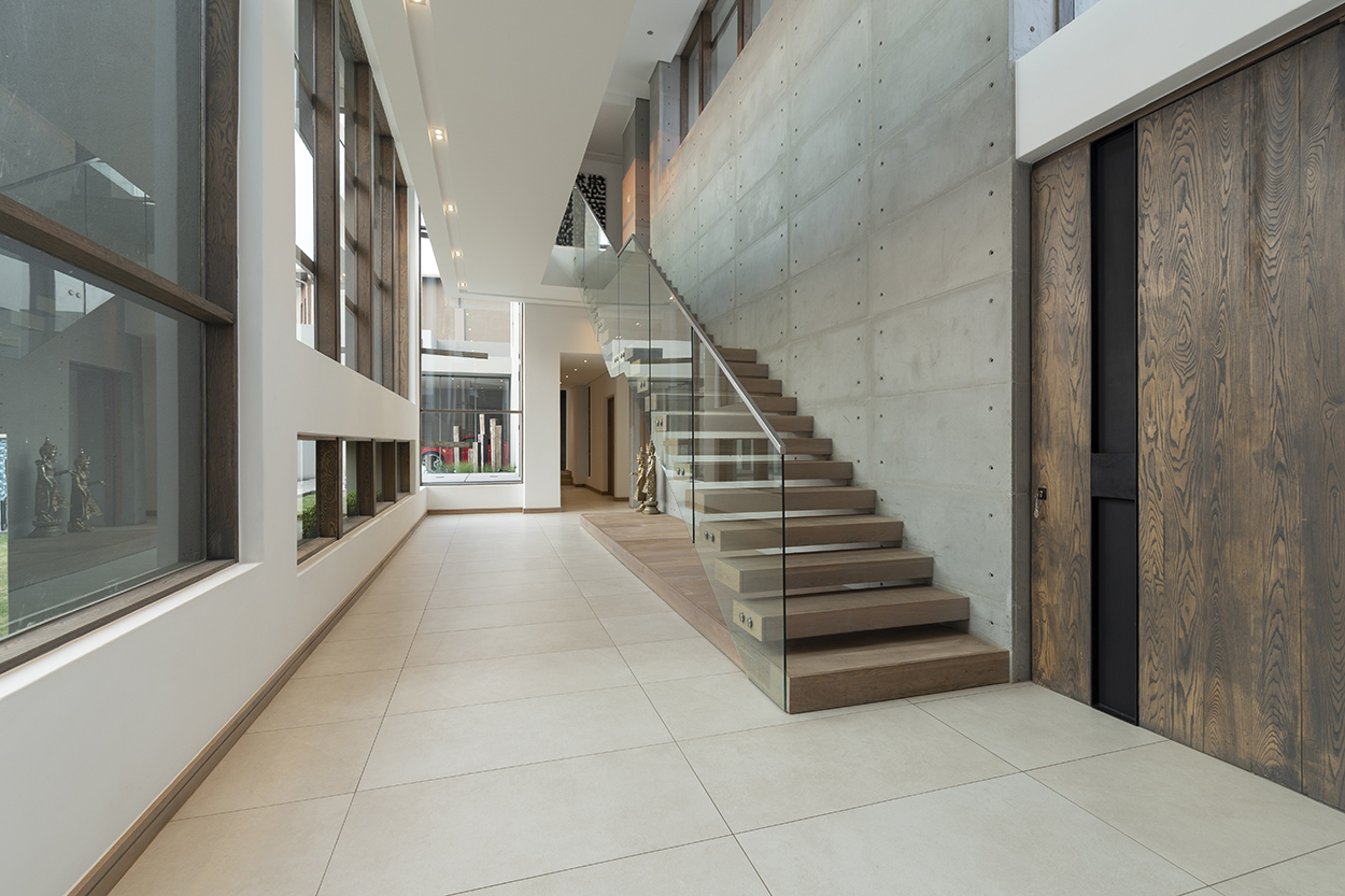 Floating staircase in a modern home with glass balustrades