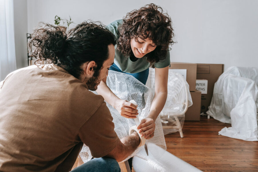 Image source: https://www.pexels.com/photo/couple-having-fun-time-while-boxing-things-7218673/