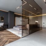 cool expensive interior design of room in prestigious luxury hotel with dark tones with modern LED lighting and stylish furniture. the area with a sink is separated by dark glass from the bedroom cool expensive interior design of room in prestigious luxury hotel with dark tones with modern LED lighting and stylish furniture. the area with a sink is separated by dark glass from the bedroom