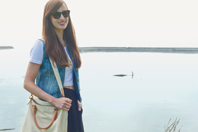 Style Bee in black maxi skirt, White crop tee, denim vest, with canvas tote