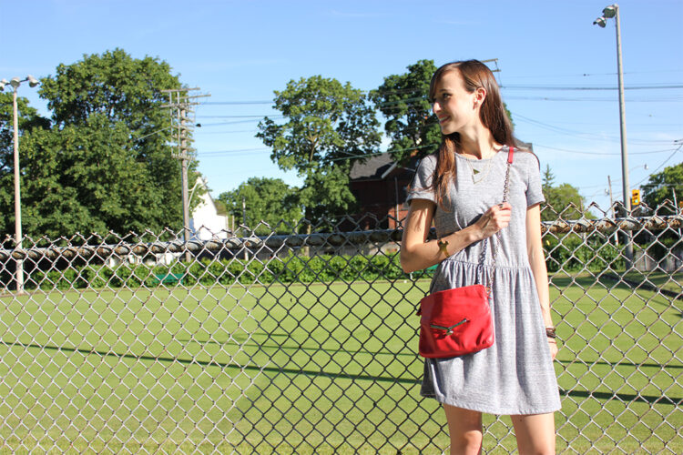 Style Bee in a grey dress, botkier bag.