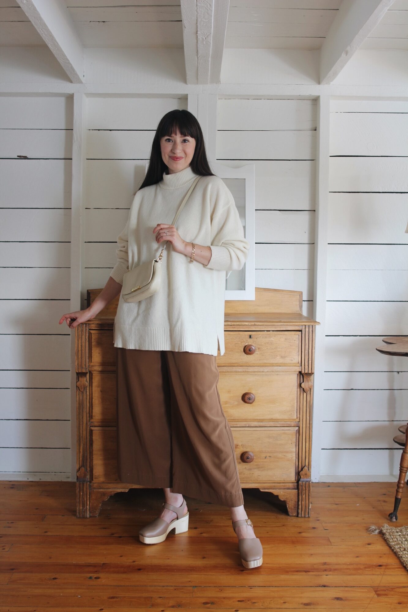 LONG CAMEL KNIT, WHITE TEE, BLACK WIDE LEG PANTS AND SUEDE CLOGS