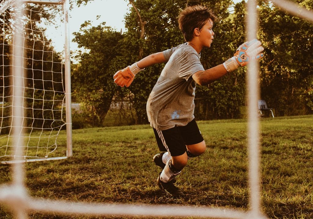 child-playing-football