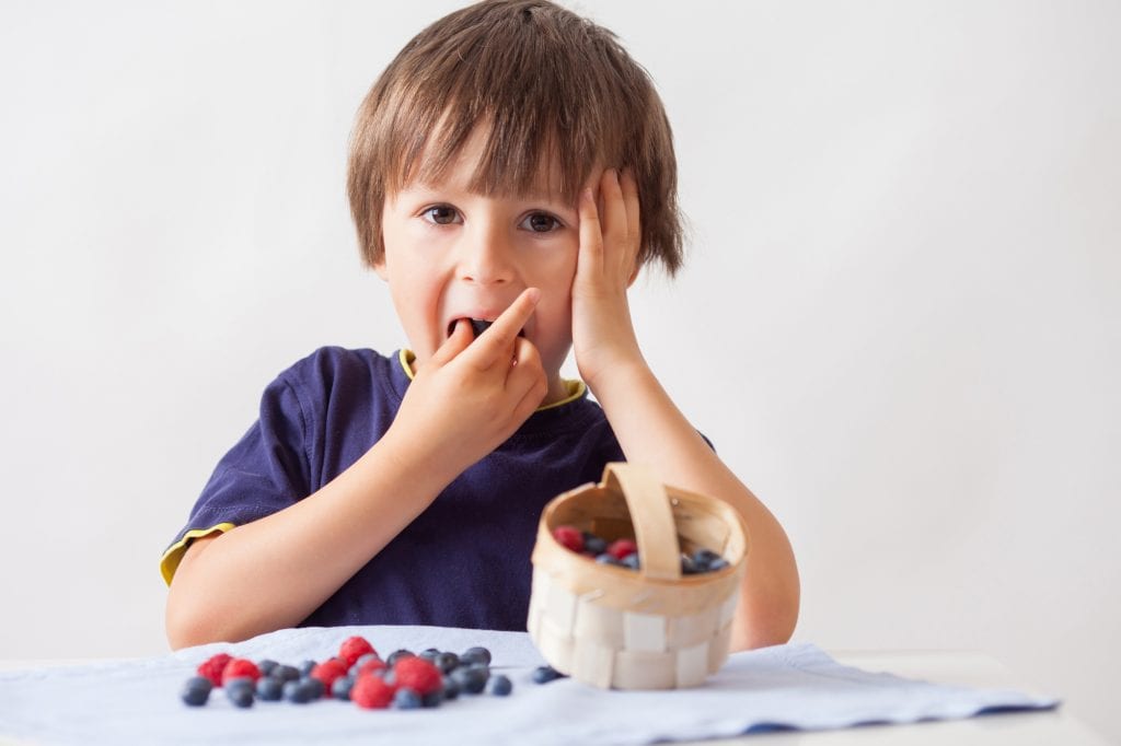 child-eating-blueberries