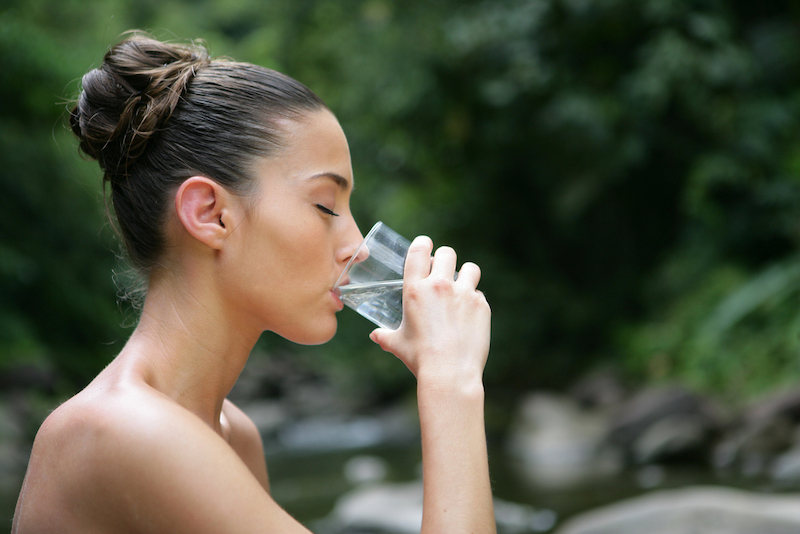 26d39bb5 woman drinking water outside