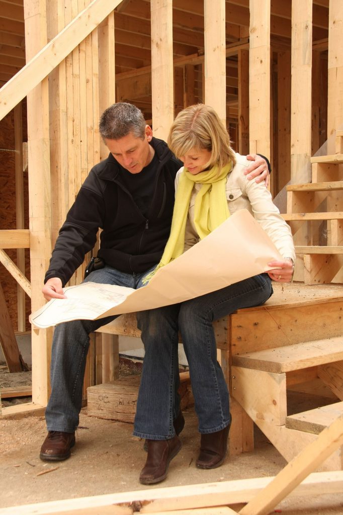 5b316622 couple looking at building plans