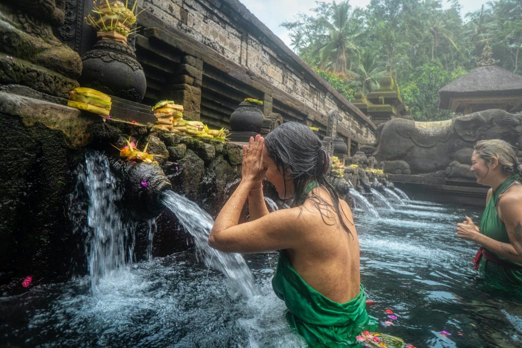 933f6e2d woman praying infront of water