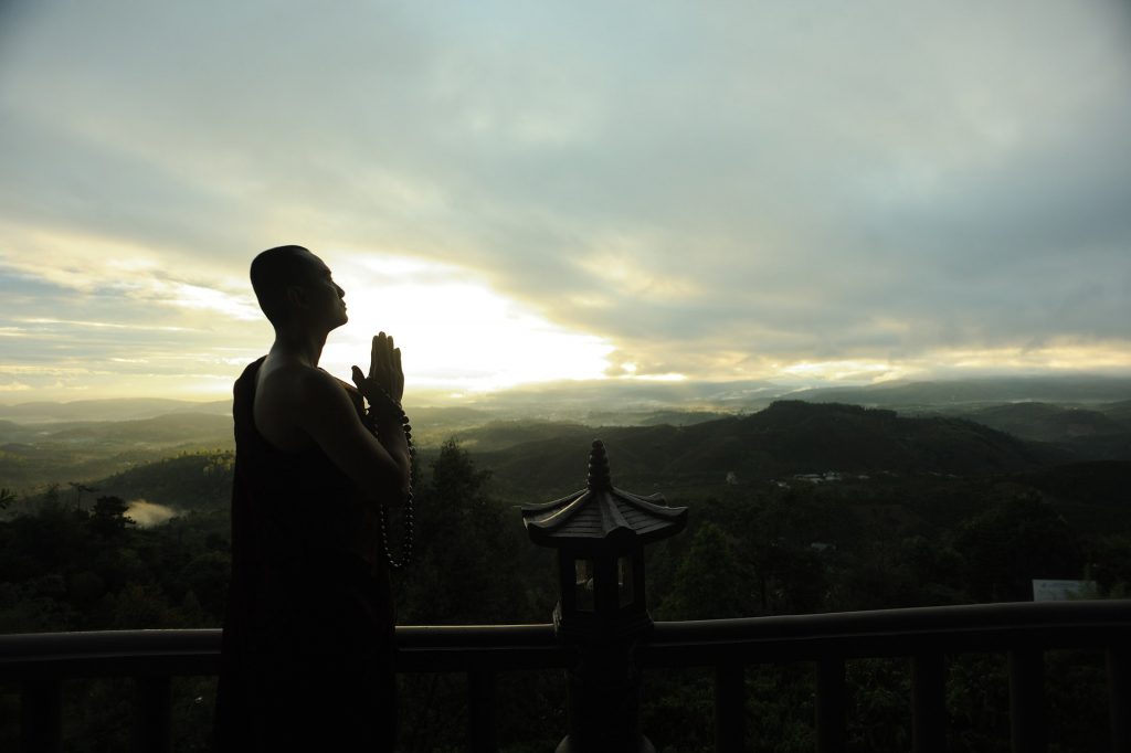 ef310c3d monk holding prayer