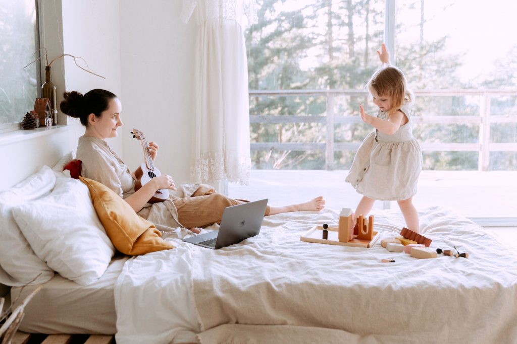 mum with child on bed