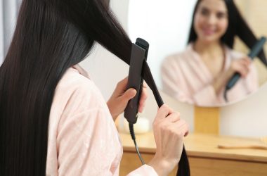 person straightening hair