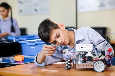 child playing with meccano