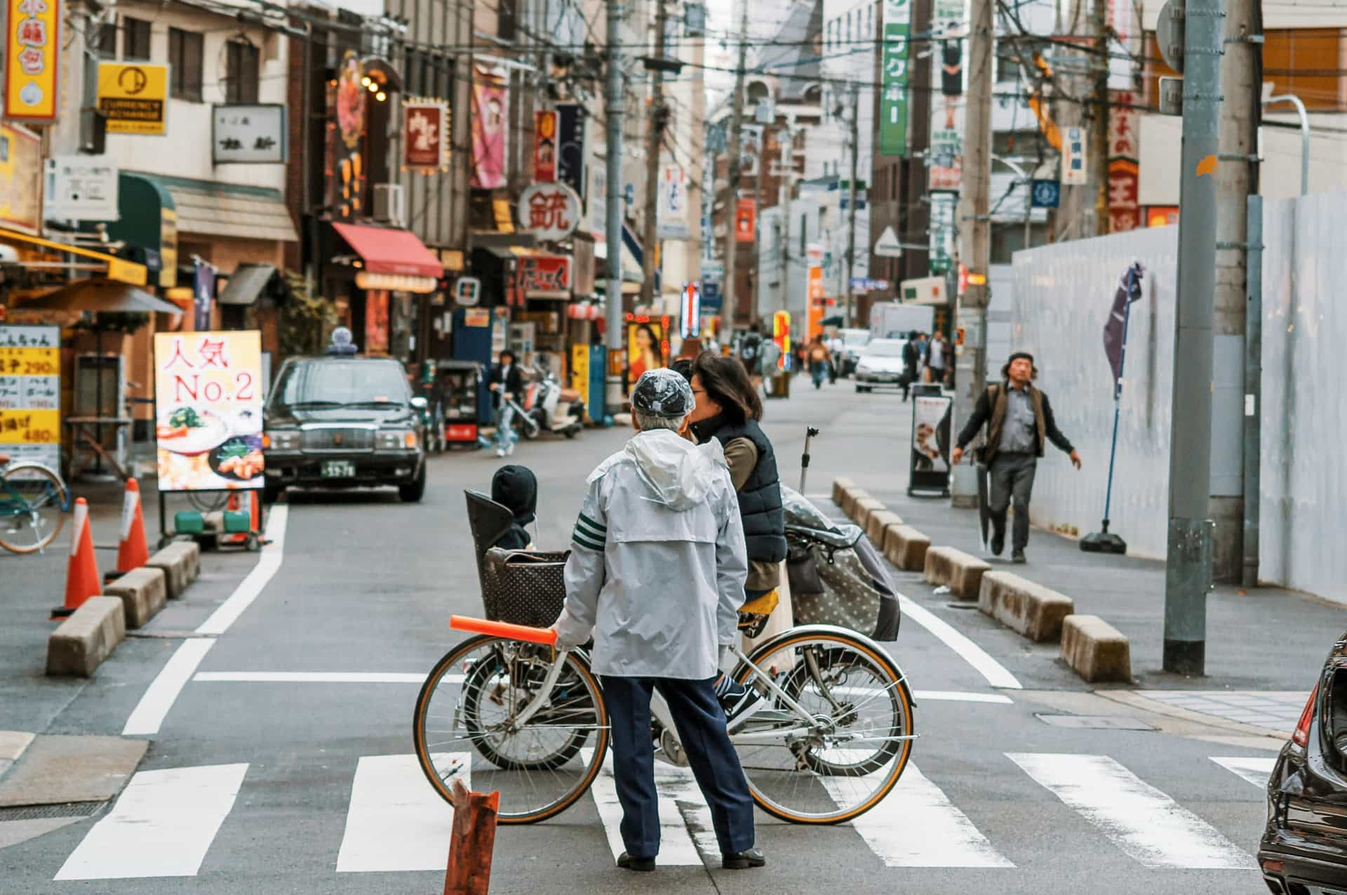 man standing in japanese street