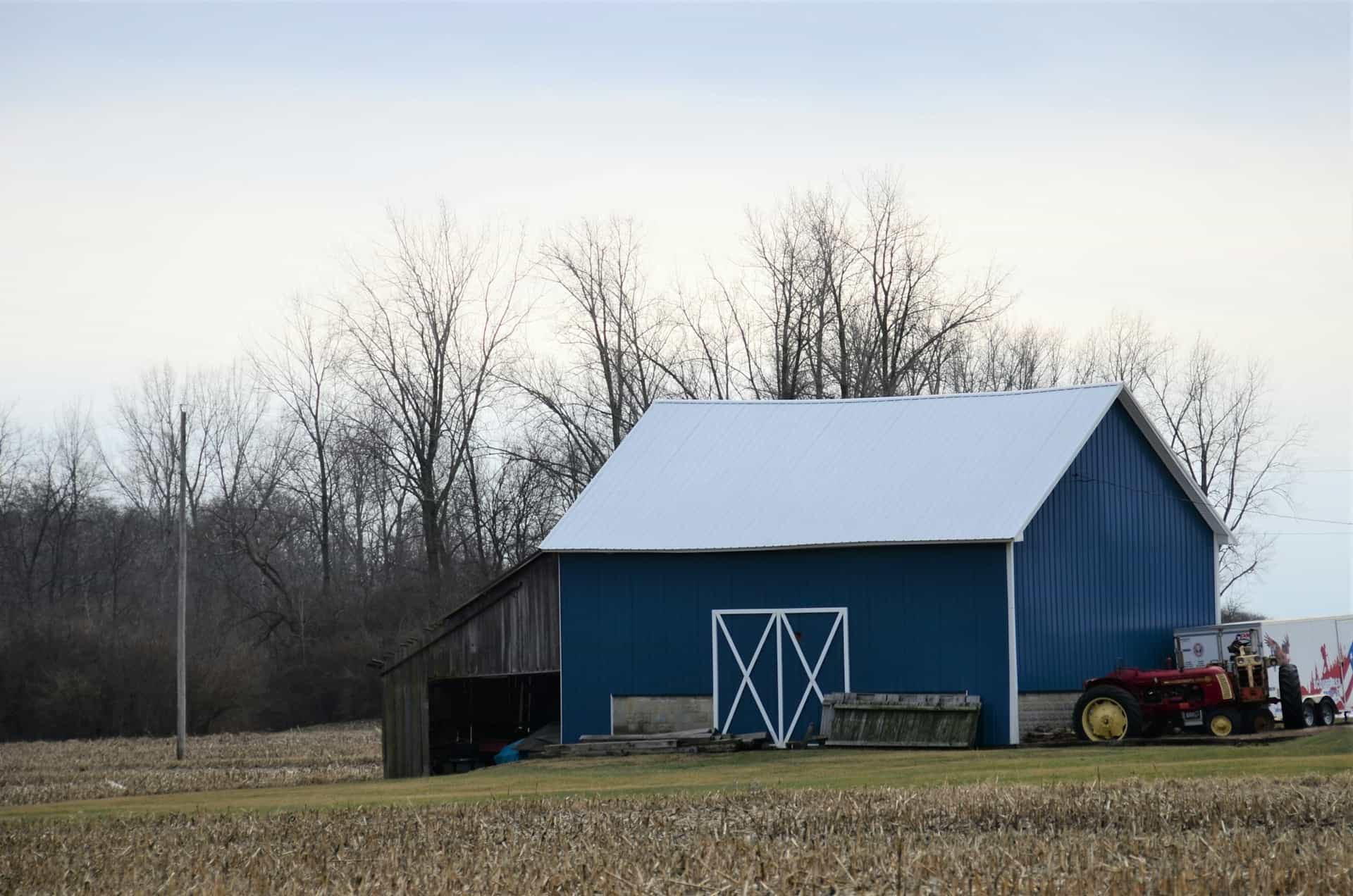 tractor infront of barn