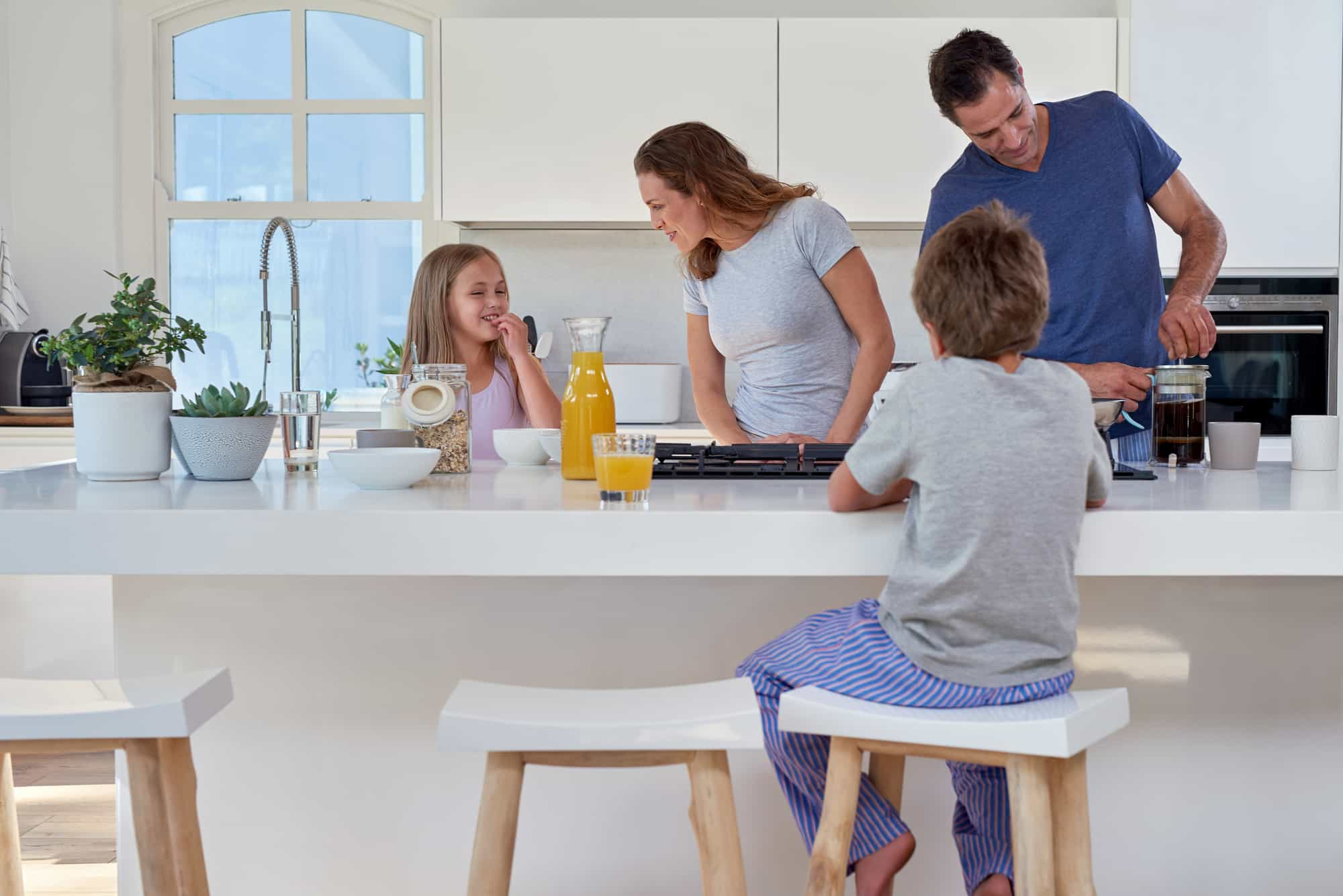 family cooking in kitchen