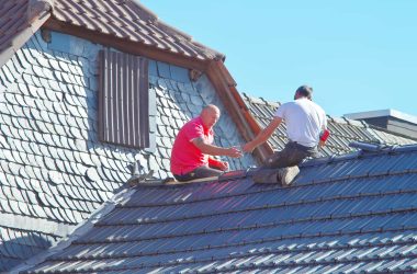 men working on roof