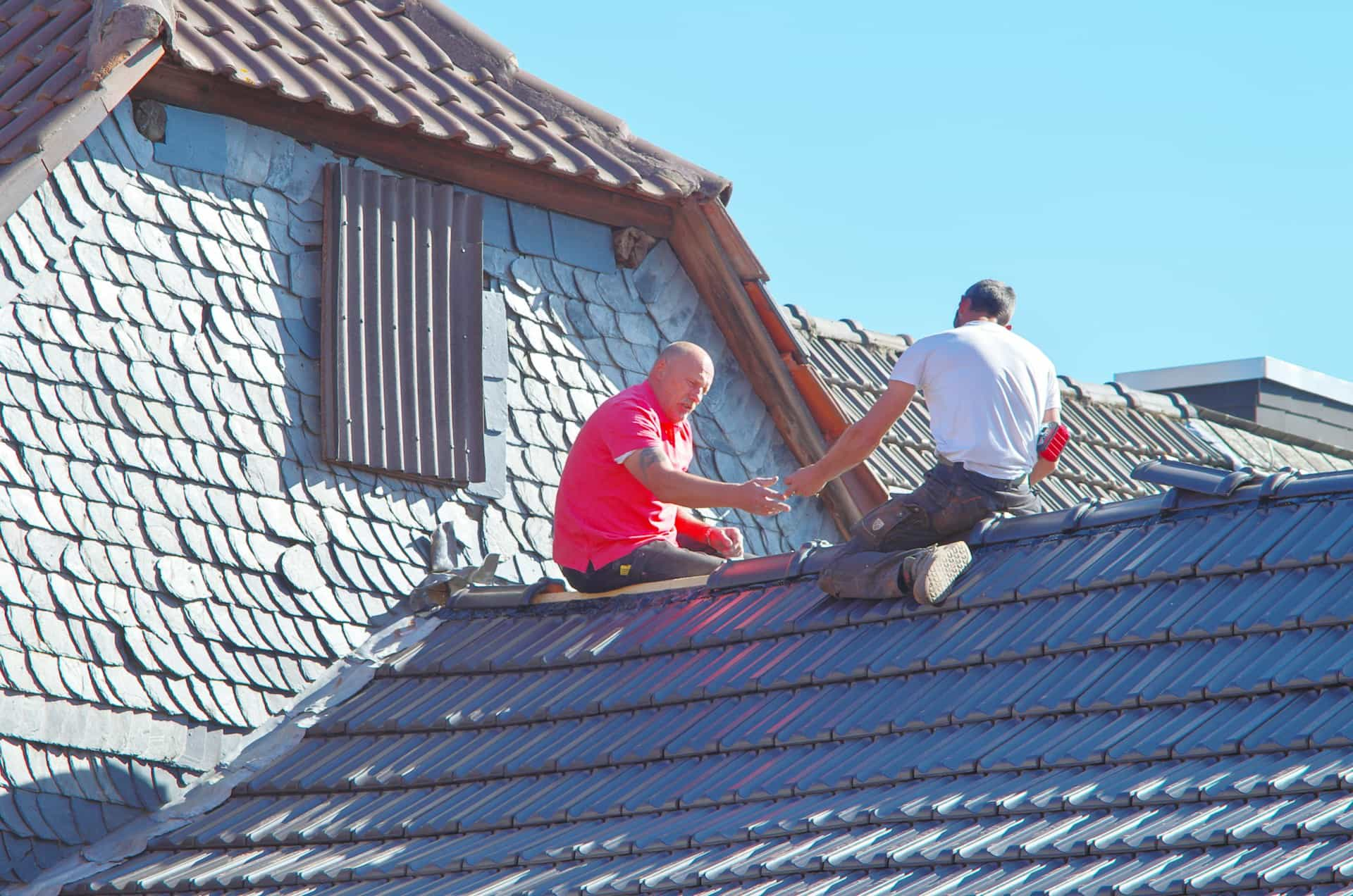 men working on roof