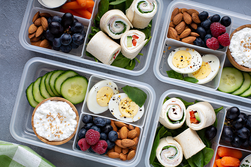 Healthy lunch or snack to go with tortilla wraps, eggs, cottage cheese, fruits and vegetables