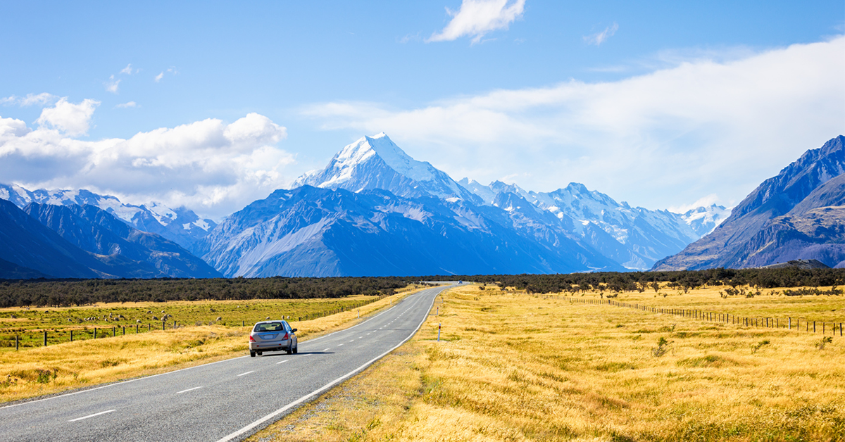 View of car, road leading to mount cook national park, South Island New Zealand