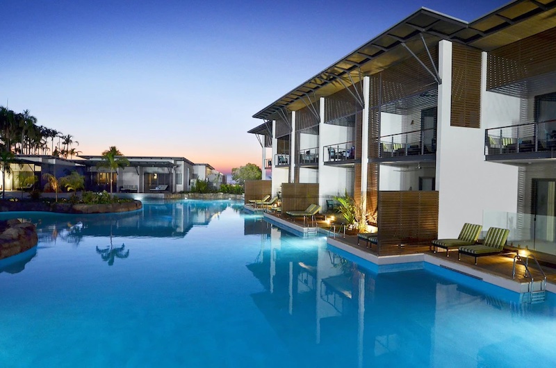 Sunset over the lagoon-style pool at Mindil Beach Casino and Resort, Darwin, NT. The ground-floor suites have private decks right on the water.