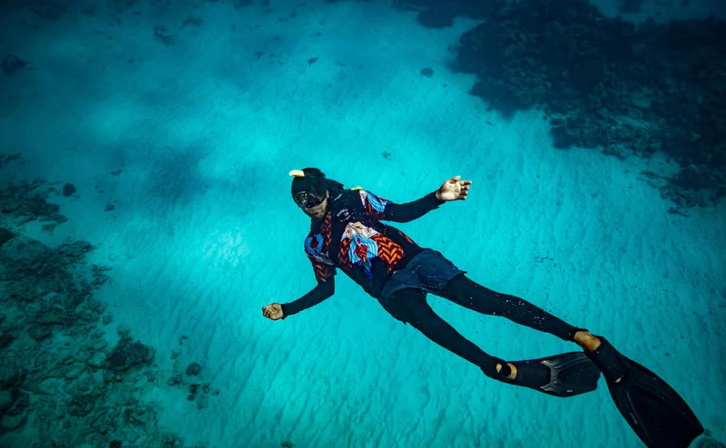 Dreamtime Snorkel diver swimming along the ocean floor