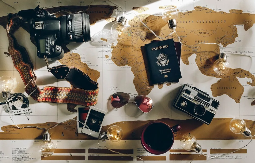 travel items spread out on a map