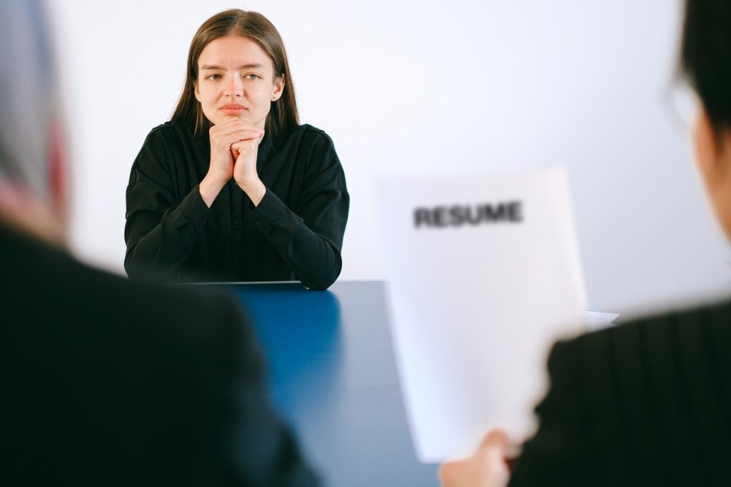 Woman in black long sleeve shirt being interviewed for an accounting job