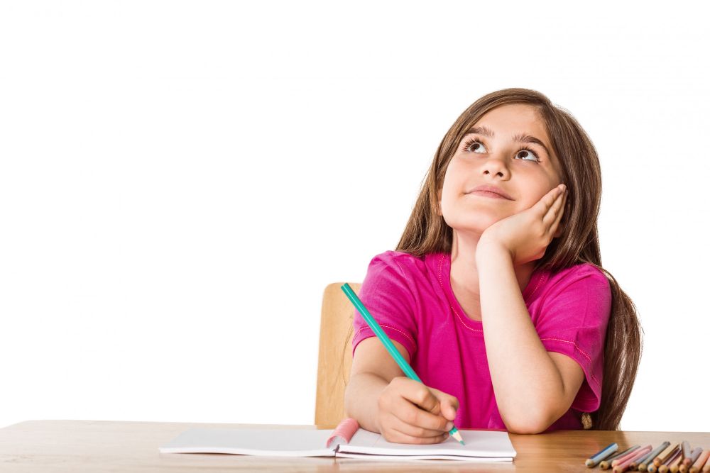 cute-pupil-working-her-desk.jpg