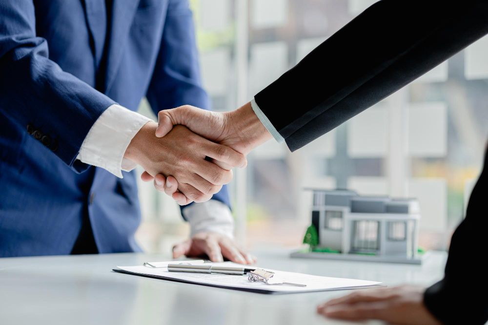 salesperson-housing-estate-project-customer-shake-hands-after-successfully-signing-contract-concept-selling-housing-estates-real-estate.jpg
