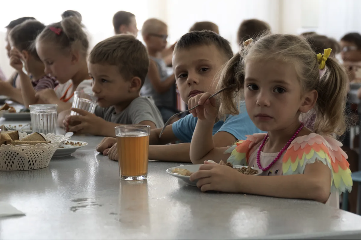 Children from an orphanage in Donetsk Region have lunch at a camp in the village of Zolotoy Kose, Rostov Region. July 8, 2022