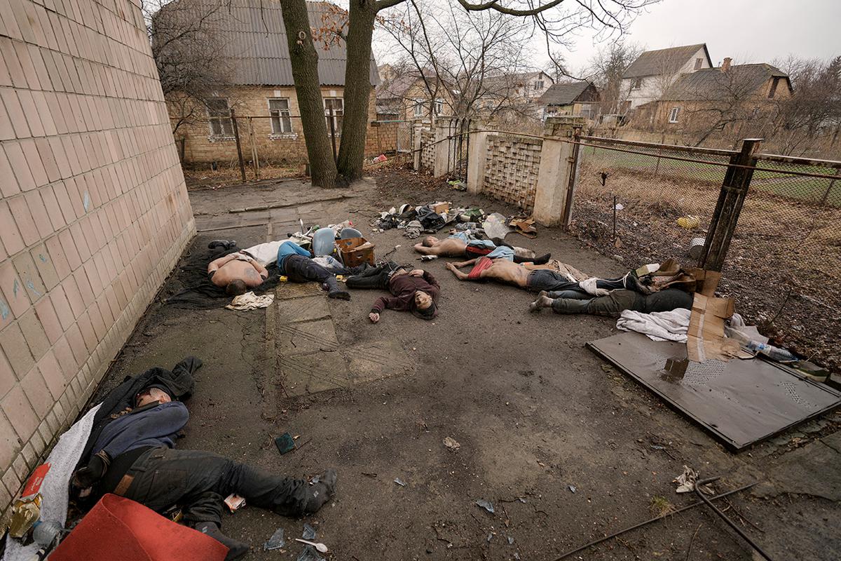 Men were taken to the corner of the house and shot (this photo was taken almost a month later, April 3)