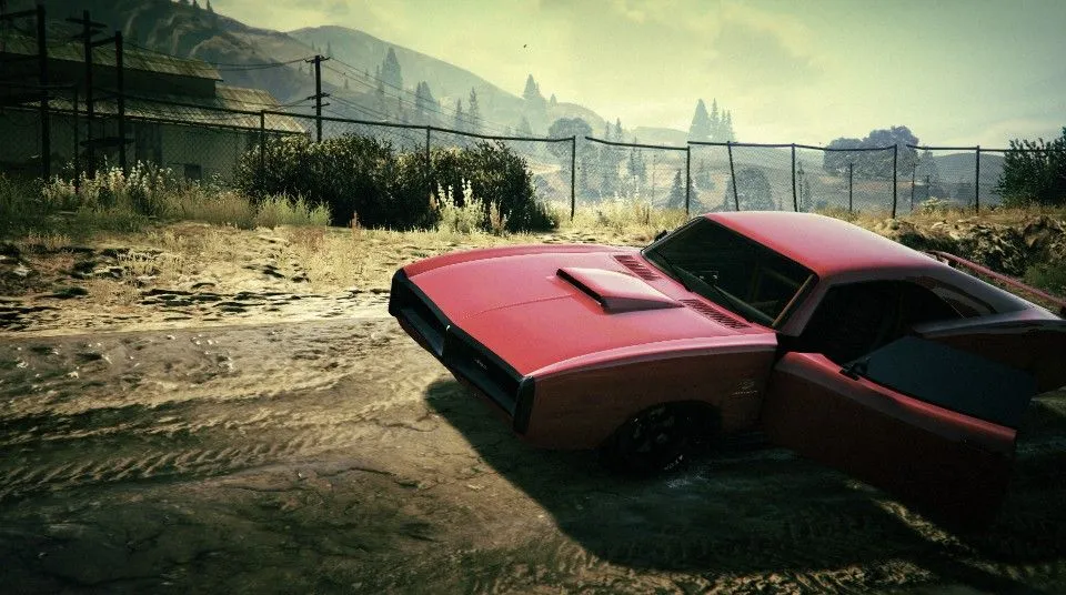 A parked car on a muddy track