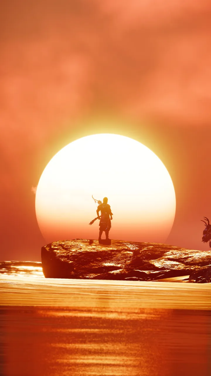 Jin standing in front of a sunrise