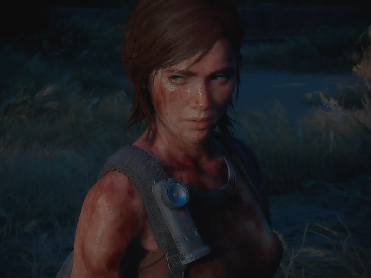 Ellie covered in blood while looking away from the camera