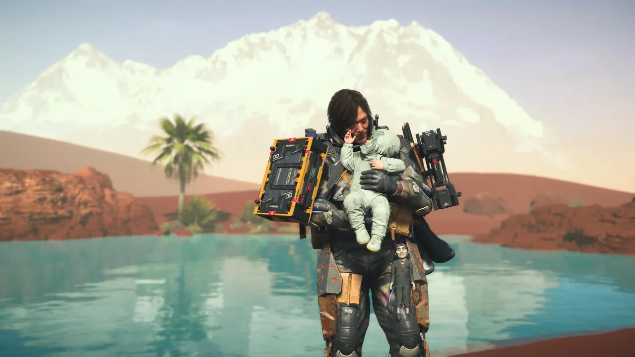 Picture of Sam and Lou in a desert oasis with a mountain behind them. 