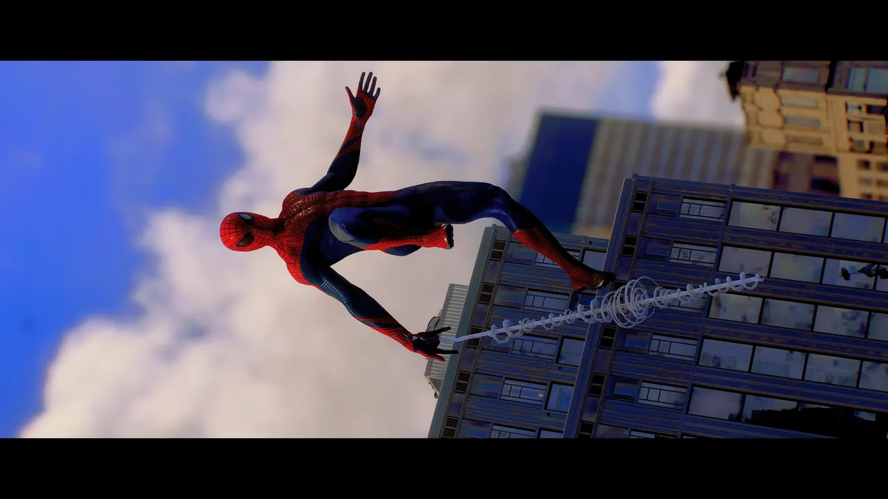 Spider-Man swinging over a building.