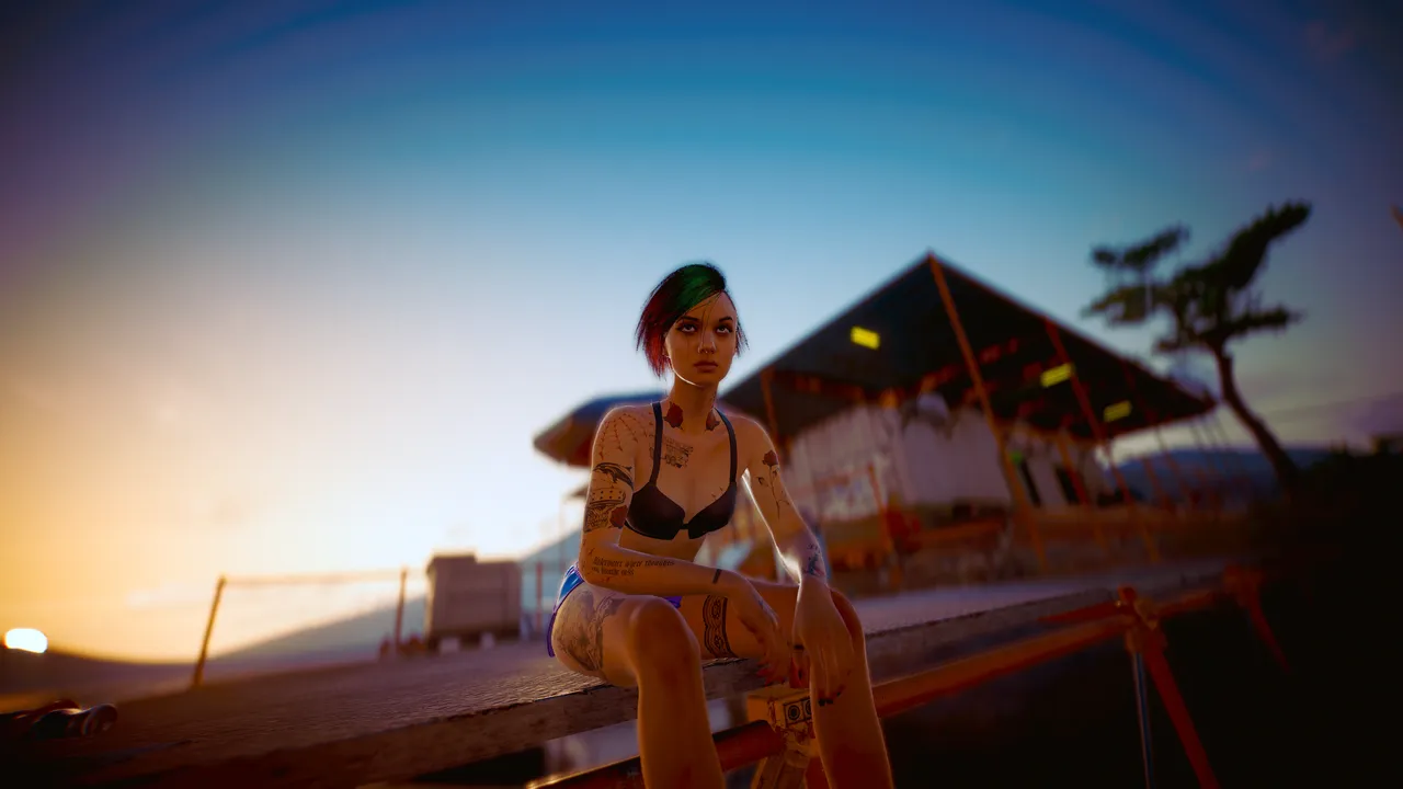 Judy Álvarez sitting on the dock at the lake.