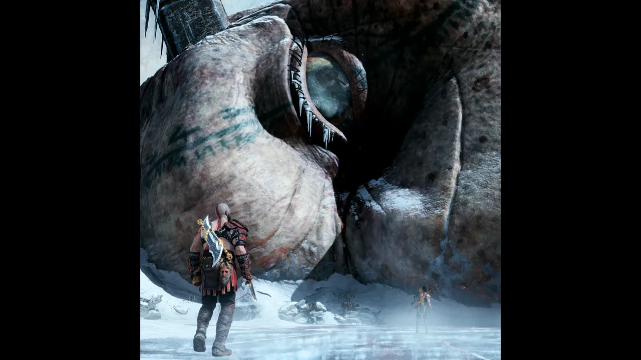 Kratos and Atreus walk on the Ice, overlooked by the lifeless gaze of Thamur, the Frost-Giant