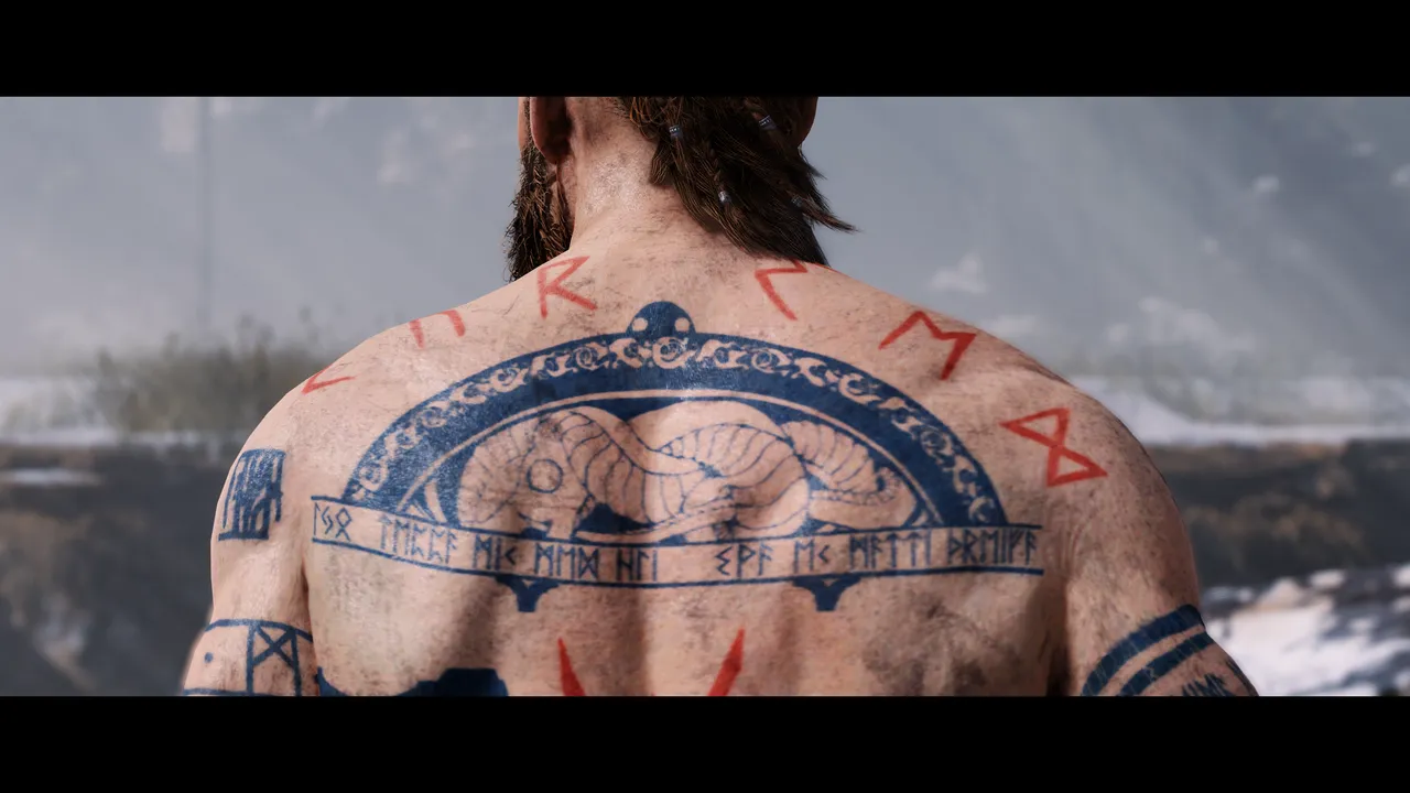 Rear shot of Baldur, close up of the tattoo's across his shoulders